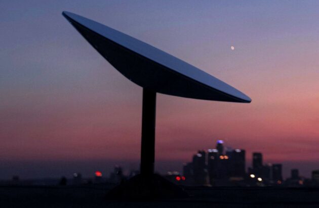 Starlink antenna with cityscape