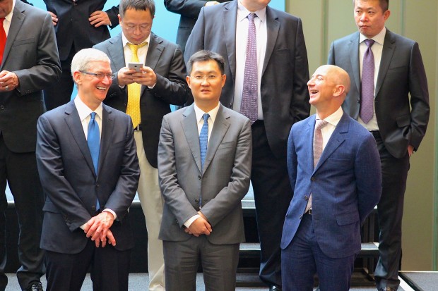 Apple's Tim Cook and Amazon's Jeff Bezos during a gathering of tech execs at Microsoft to greet Chinese President Xi Jinping this week.