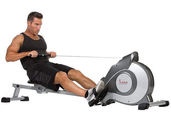 person using a rowing machine -- best rowing machines
