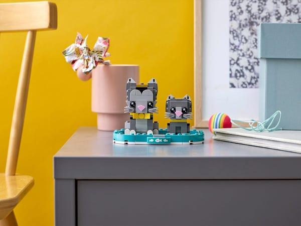 an end table with two gray cats made from lego brickheadz