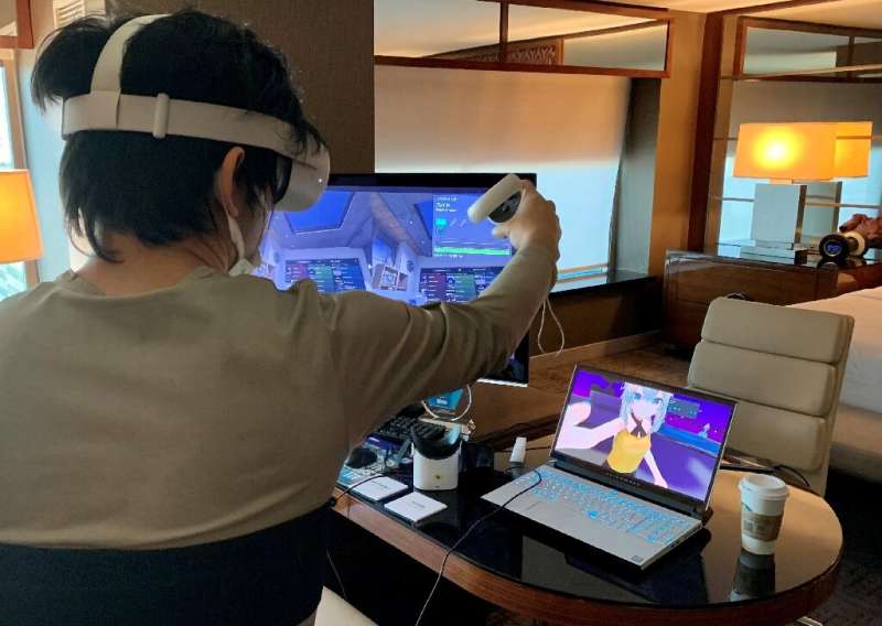 Takuma Iwasa, Shiftall CEO, demonstrates the Haritora X, a full body tracking system for virtual reality, at the Consumer Electr